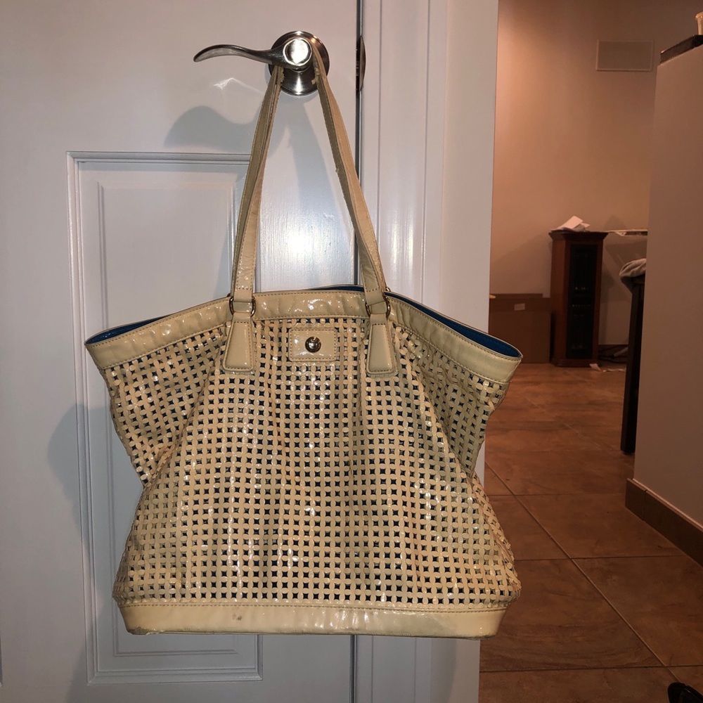 JPK cream purse with mini blue pocket purse within